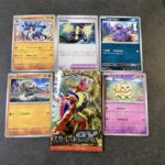 セブンイレブンで購入した拡張パック「スカーレットex」を開封したところ、今回は大きな当たりカードは出ませんでした！ それでも注目したのはトレーナーズカード「学習